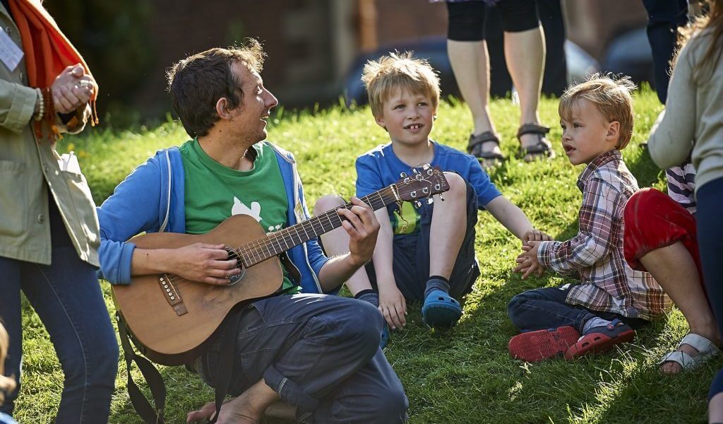 Children singing on family retreat