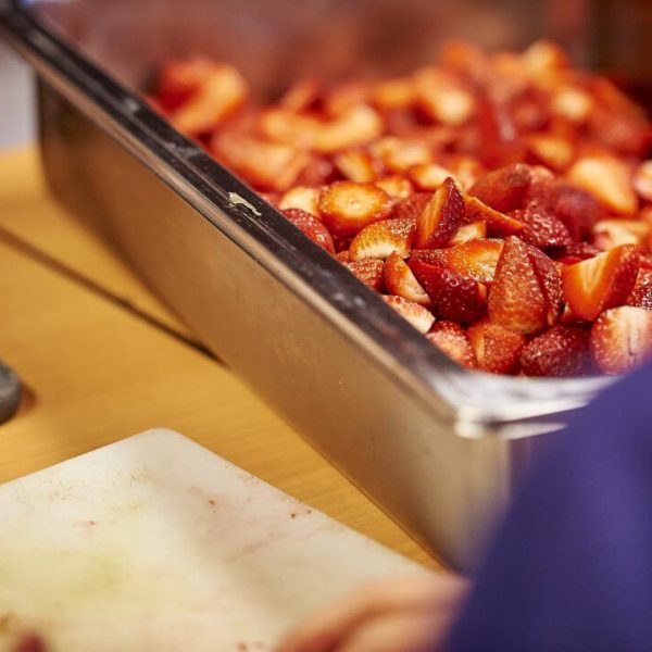 Strawberries being prepared on retreat