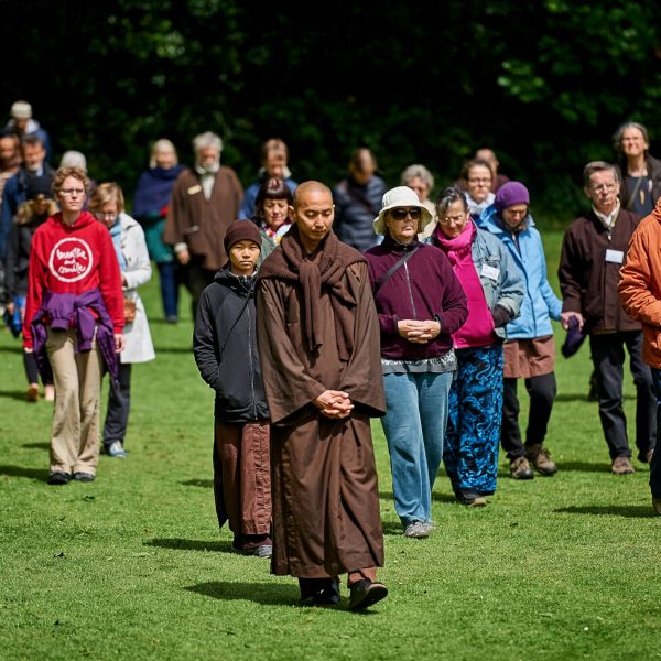 Monastics and others practicing walking meditation