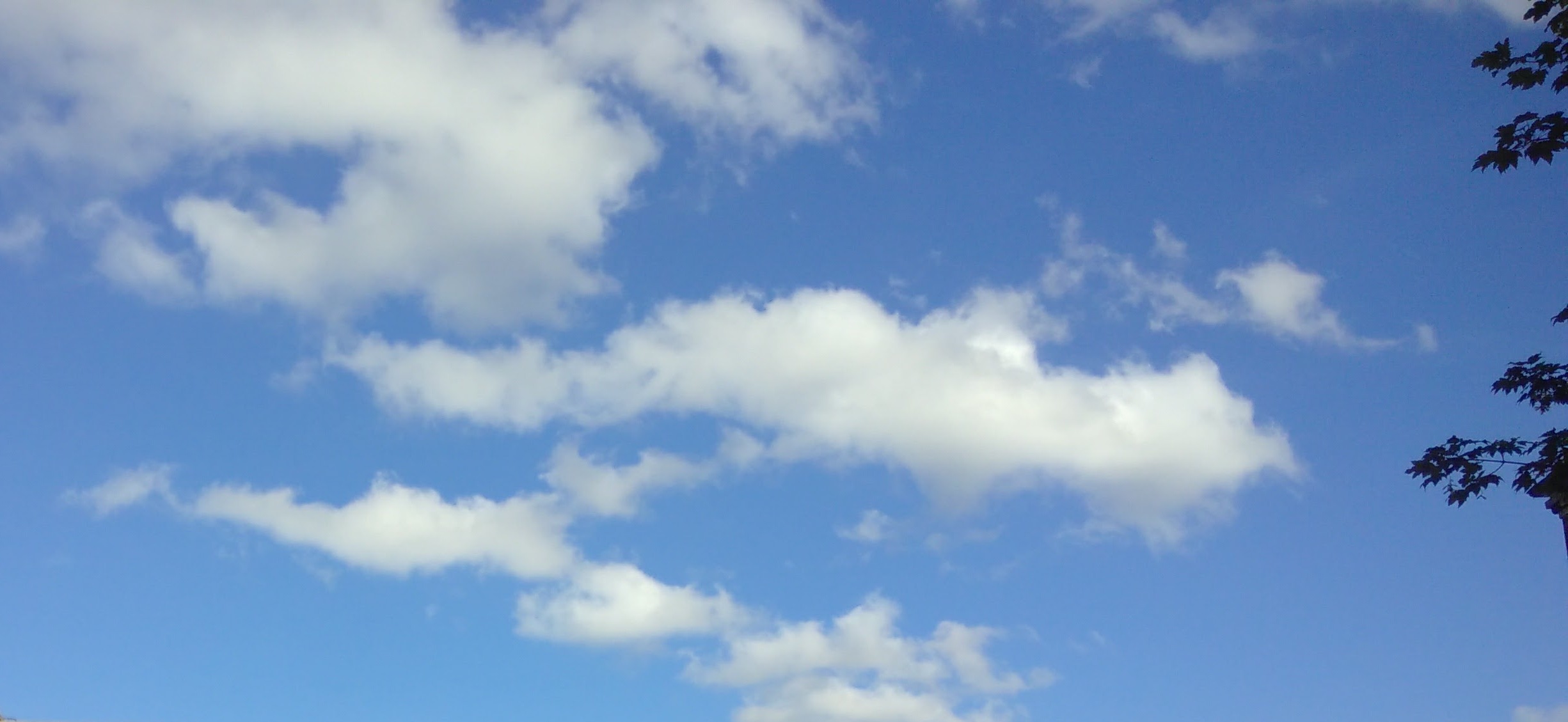 White clouds against blue sky