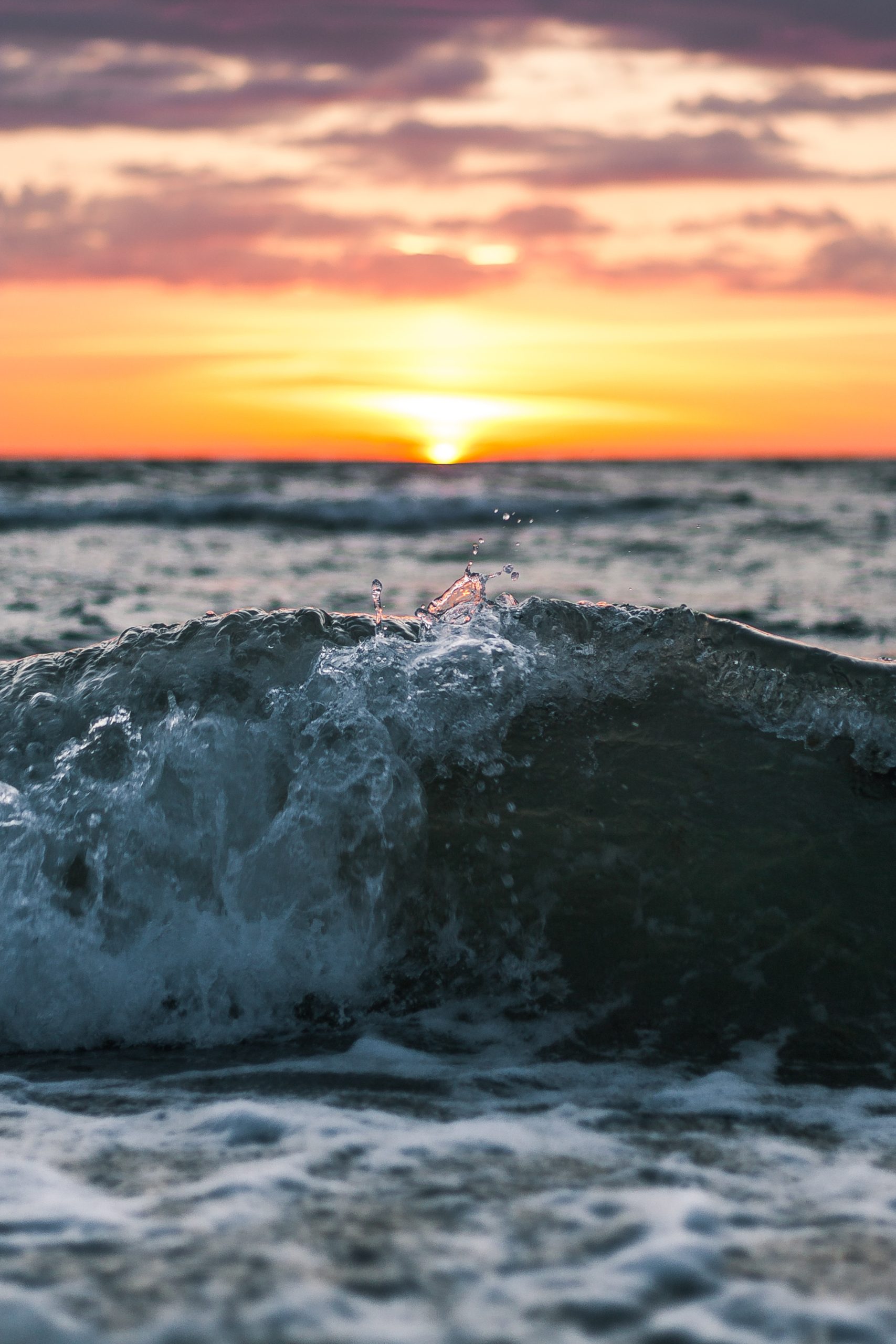 Waves against sunset