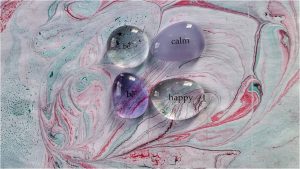 Marbled paper with the words Be Calm Be Happy on