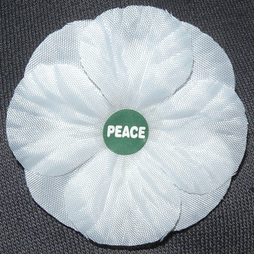 white poppy with the word 'peace' in the centre