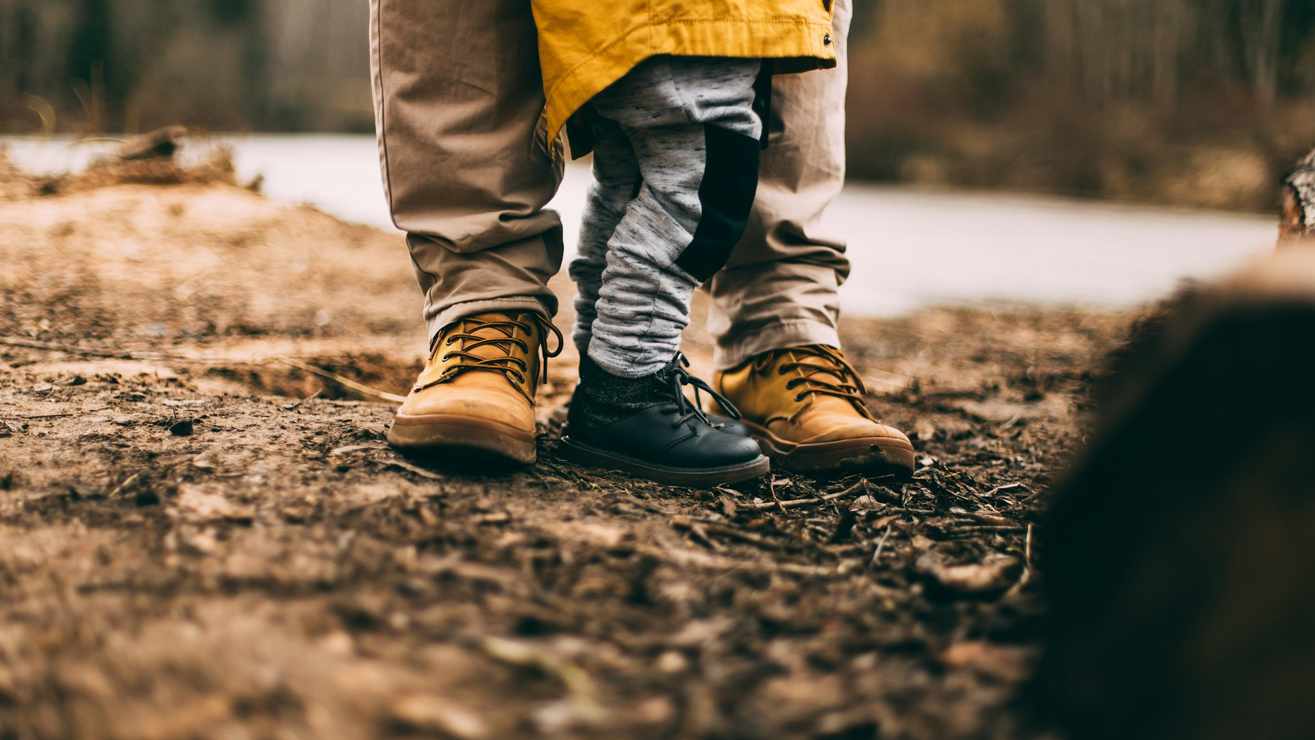 Feet of an adult and child