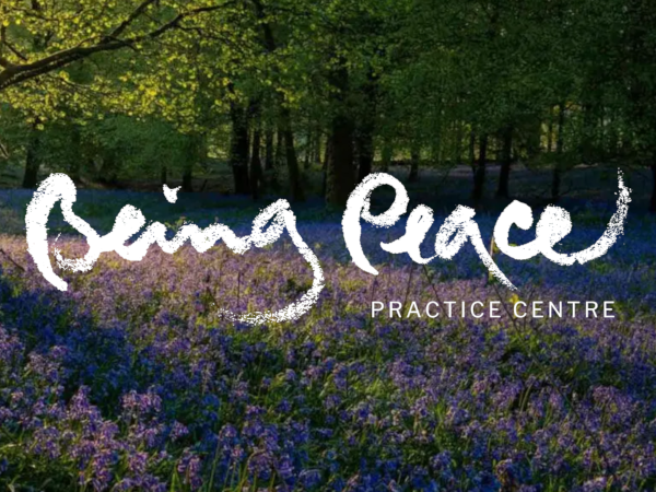 Being Peace calligraphy across image of bluebell wood