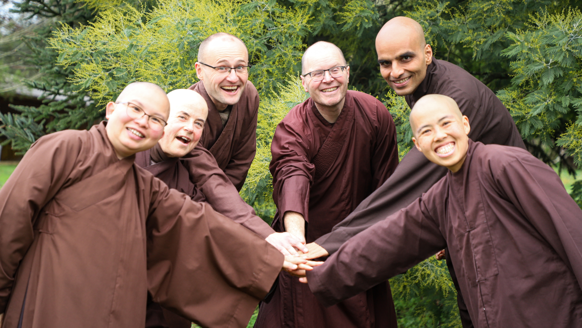 Group of six monastics that are coming to Scotland