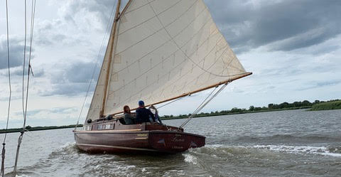 Yacht sailing on the Norfolk broads