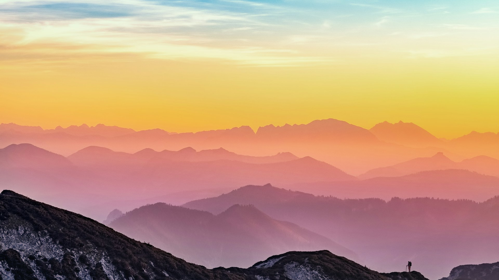 Colourful sky across mountains