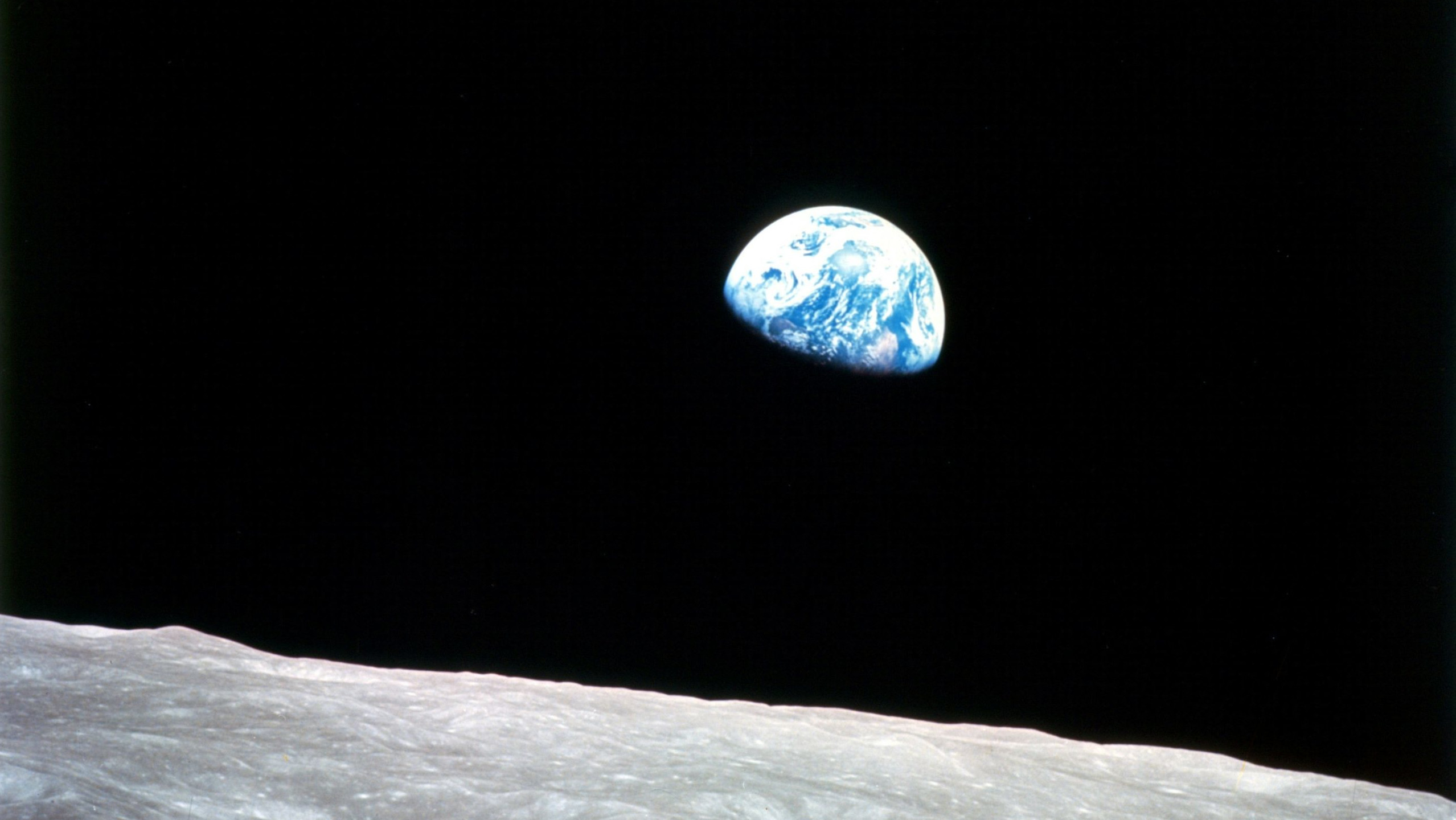 Earth rising viewed from the moon.